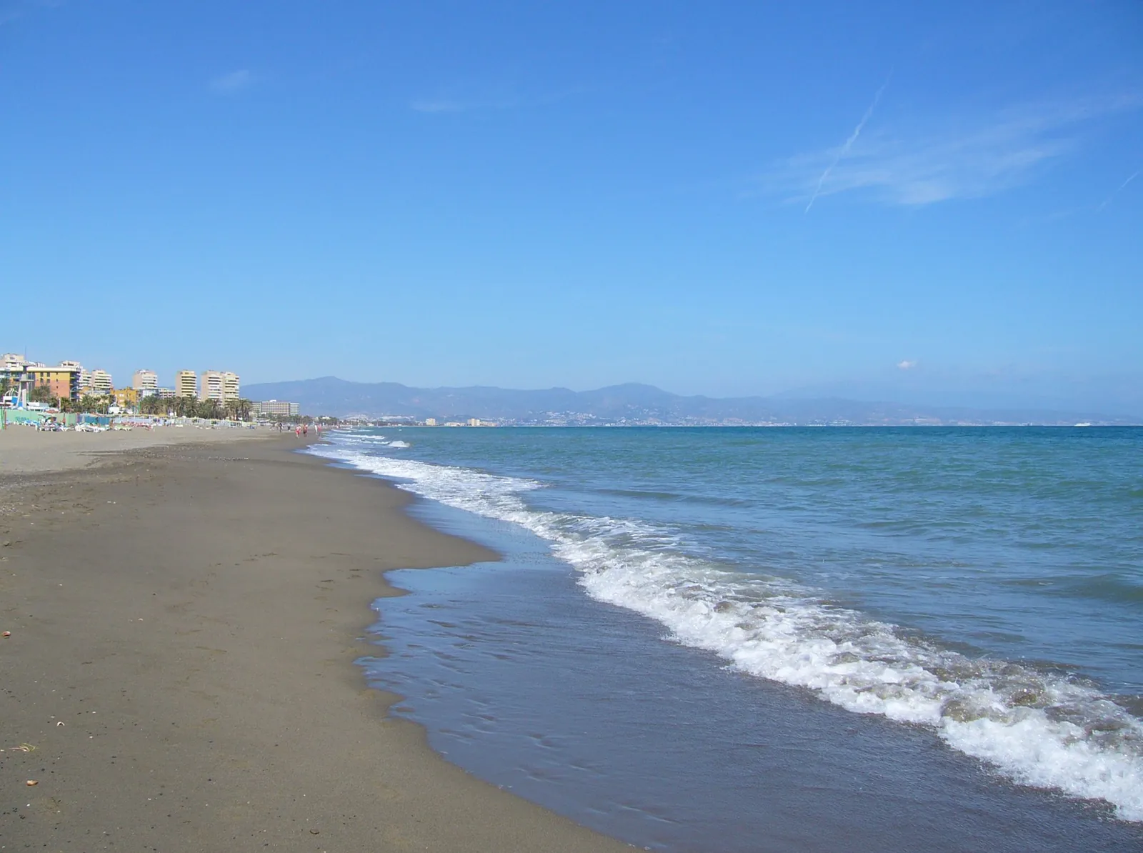 Looking along Torremolinos beach and its coastal buildings